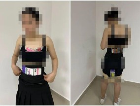 女子身上绑藏50余台旧手机、手表表盘进境被查